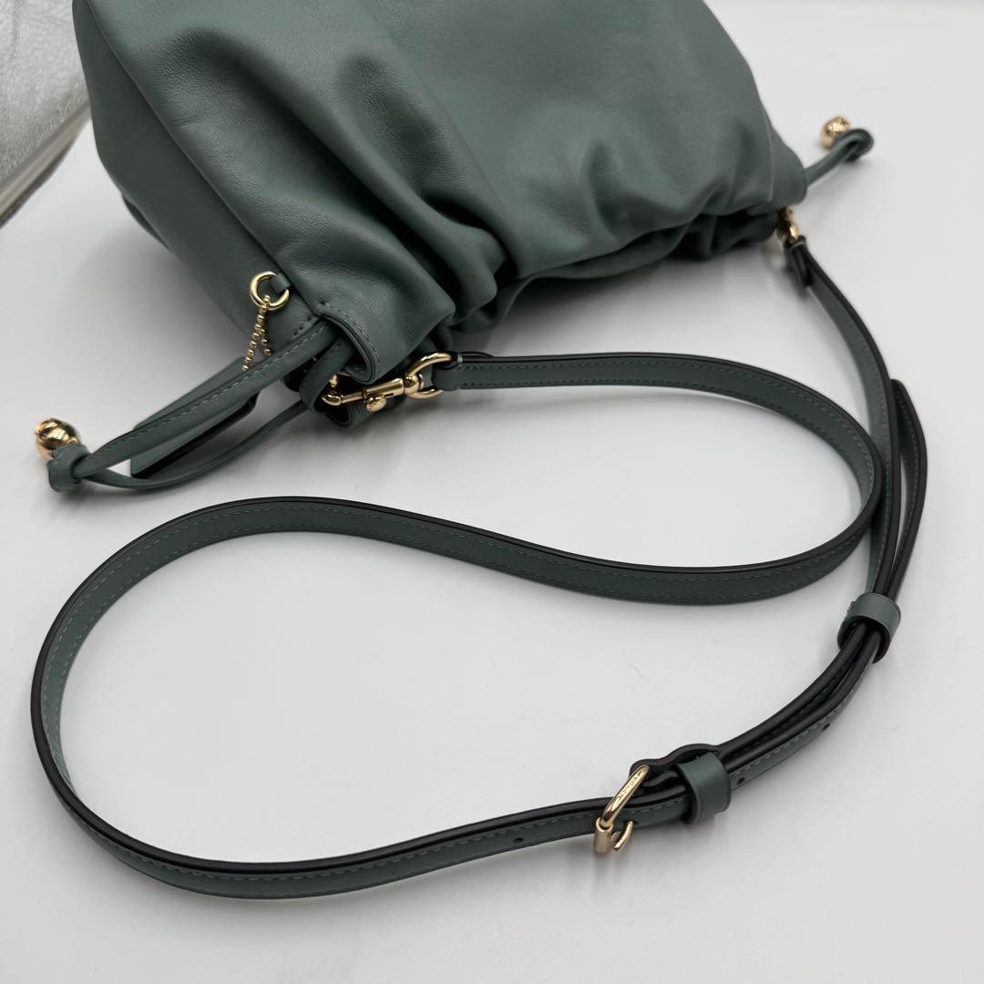 美品✨ コーチ フェイ ドローストリングバッグ レザー 巾着 ゴールド金具 水色