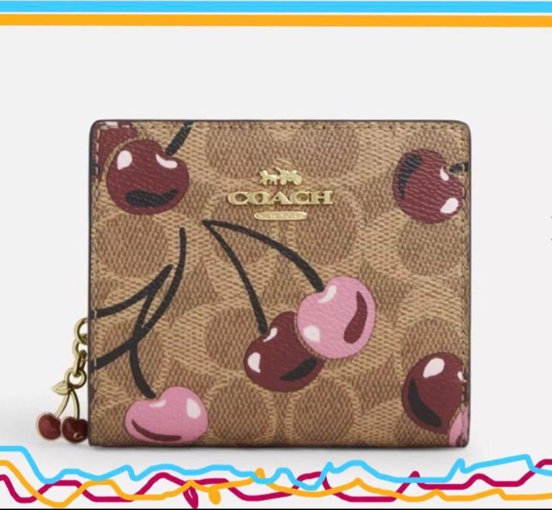 COACH シグネチャーチェリープリント二つ折り財布、さくらん