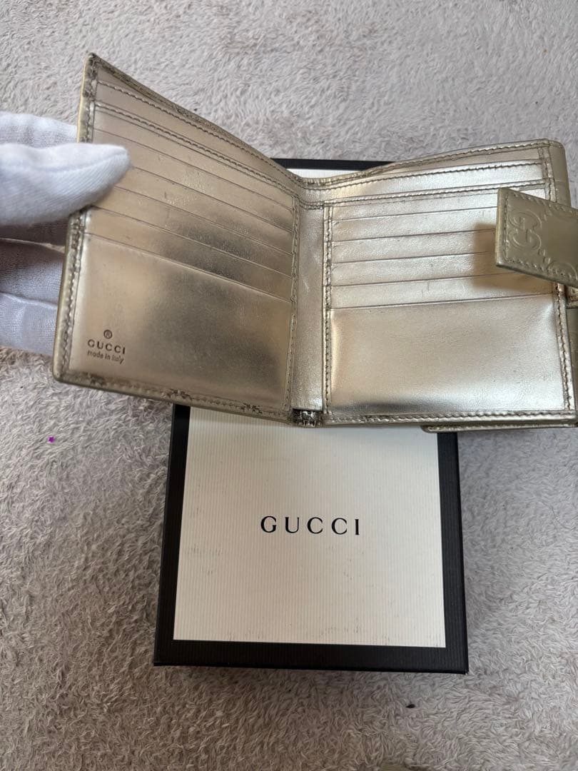 8*様 GUCCI ゴールド　二つ折り財布　グッチ　GGマーク