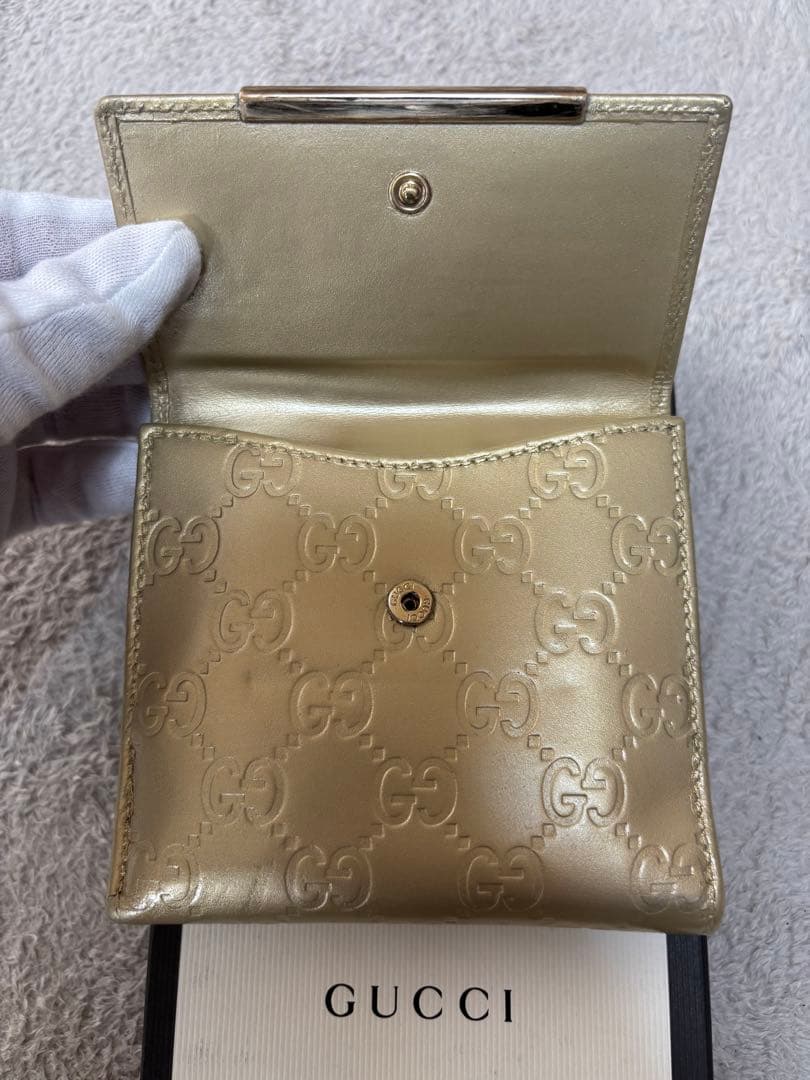 8*様 GUCCI ゴールド　二つ折り財布　グッチ　GGマーク