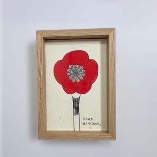 鮮やかな赤いカラーが印象的な原画